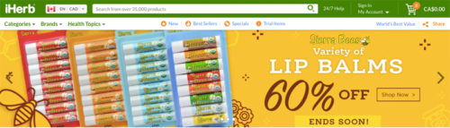 Screenshot of iHerb homepage, showing 60% off discount for a variety of lip balms.