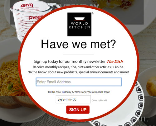 A popup from World Kitchen asking shoppers "Have we met?" with plates of food in the background.
