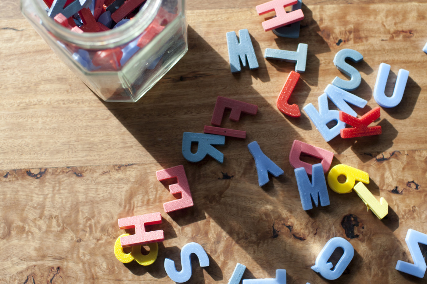 Toy letters across a table featured image