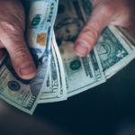 hands holding cash featured image