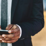 business man checking smartphone