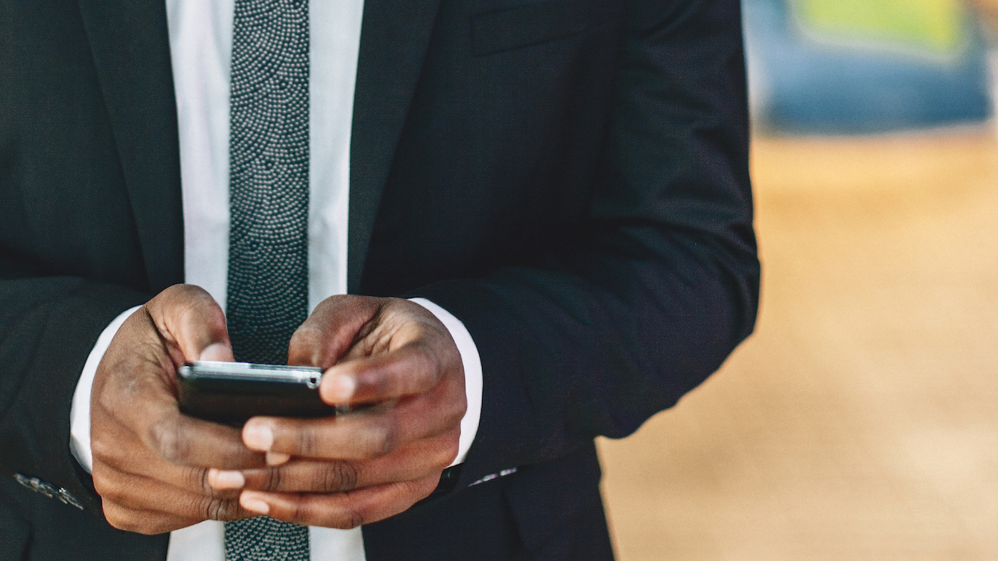 business man checking smartphone