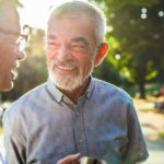 Two older men chatting in the park featured image
