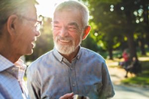 Two older men chatting in the park featured image