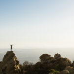 woman on a boulder in nature